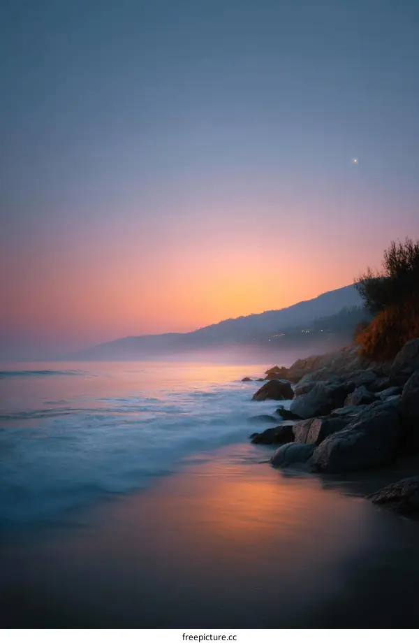 Sunrise Coastal Serenity with Rocky Shore
