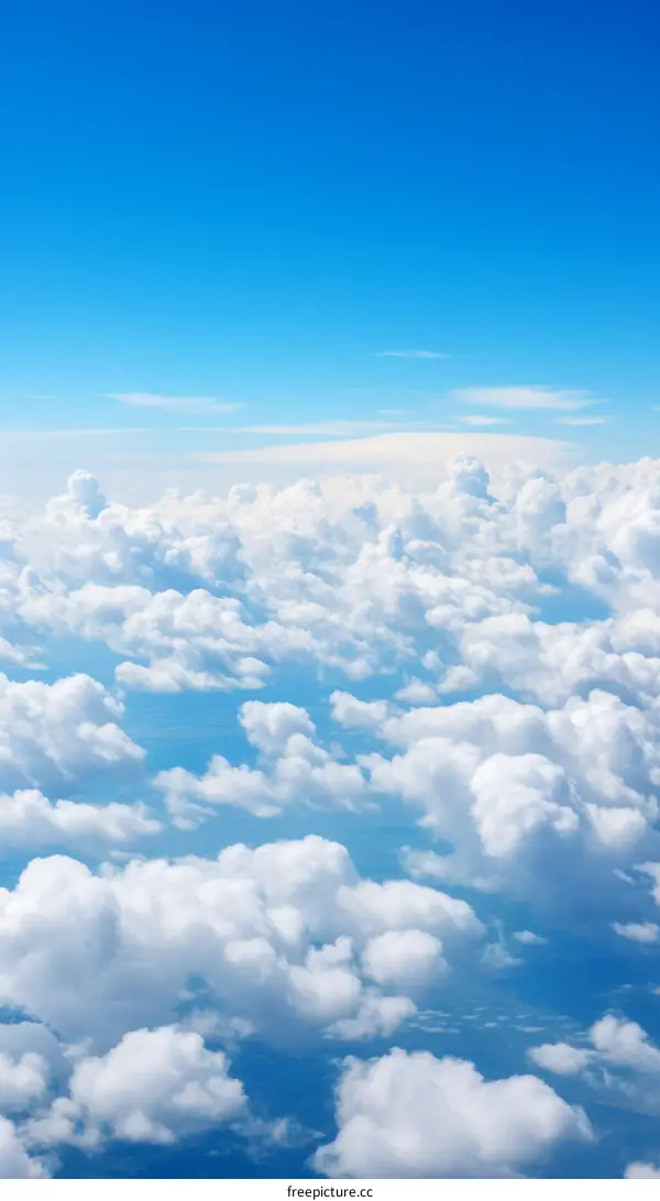 Blue sky and clouds from airplane window