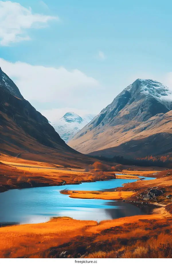 Serene Mountain Lake Landscape with Snow Capped Peaks