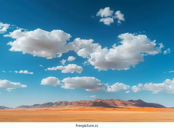 Vast White Clouds over Desert Landscape
