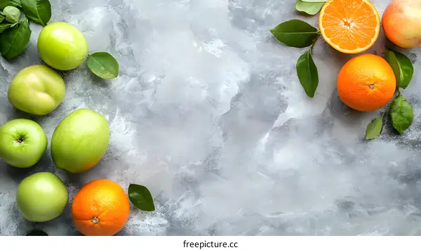Fresh Apples and Oranges on Gray Background