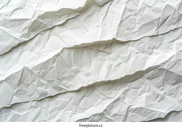 Close-up of crumpled white paper texture background