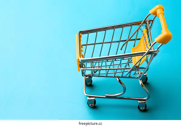 Small Yellow Shopping Cart On A Blue Background