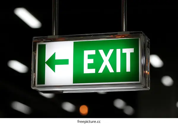 Illuminated Emergency Exit Sign in Dark Setting