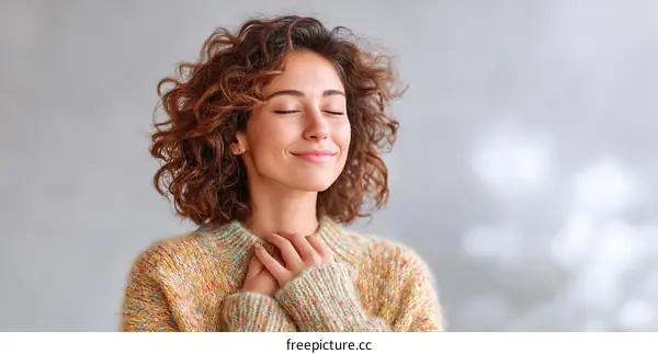 Woman Relaxing with Closed Eyes in a Cozy Sweater