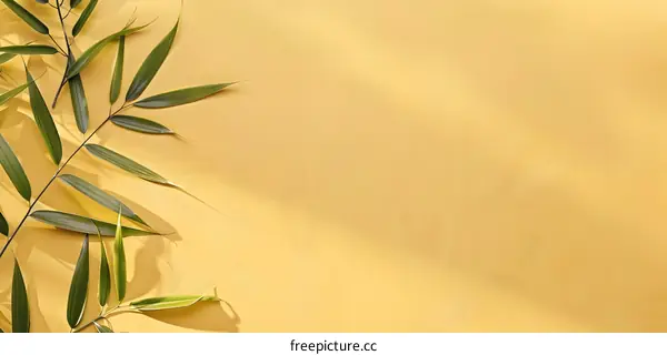 Green Leaves on Yellow Background