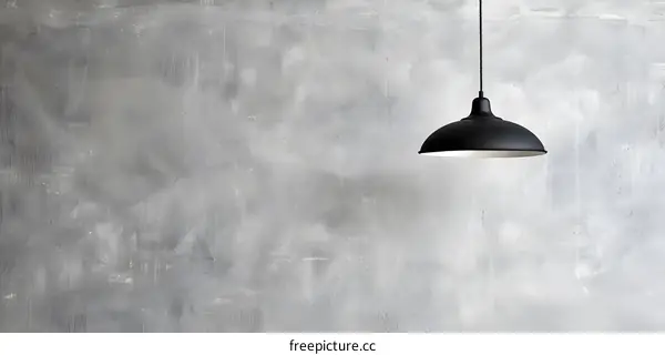 Modern Black Pendant Lamp Hanging On Grey Wall