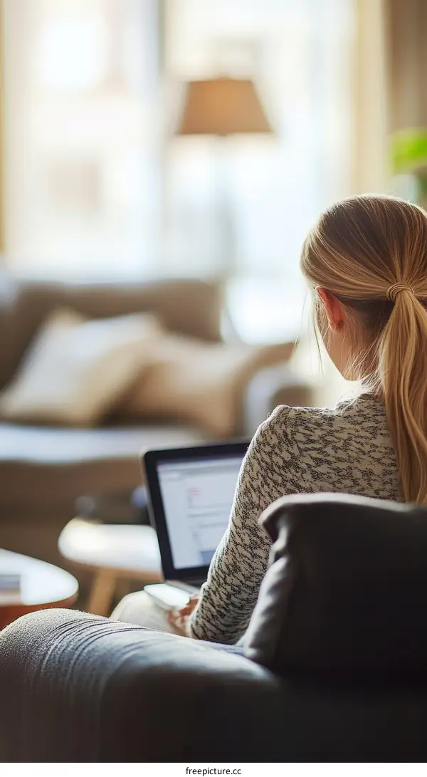 Woman Working on Laptop in Cozy Home Interior