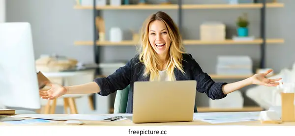 Successful Woman Celebrating in Modern Office
