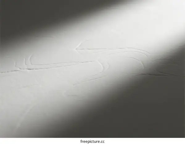 Abstract Light and Shadow Pattern on White Paper Surface
