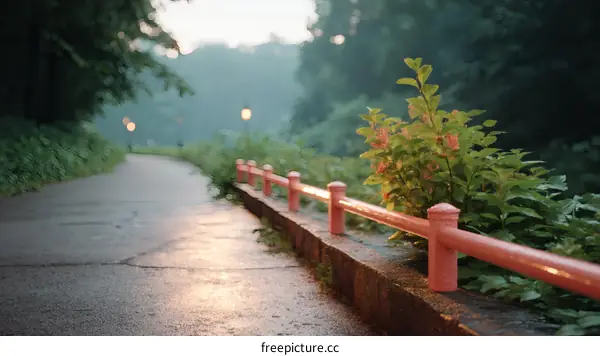 A Misty Morning Path in a Park with Pink Railing