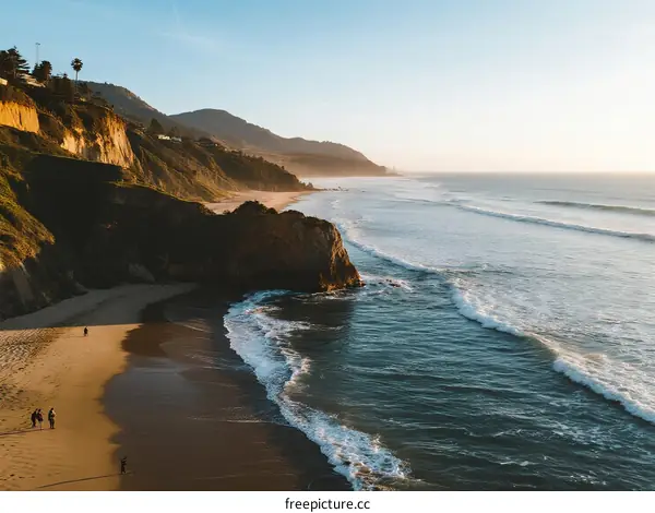 Scenic Coastal Beach with Gentle Waves at Sunset