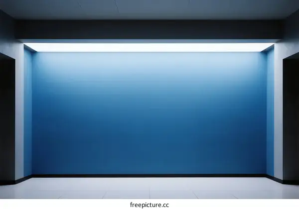 A Minimalist Blue Wall with Bright Ceiling Lighting in an Empty Room