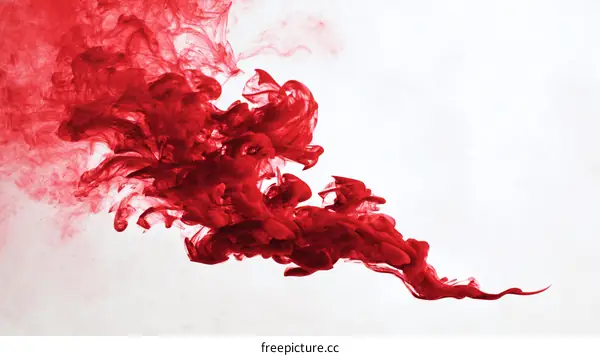 Abstract Red Ink Flowing in White Background