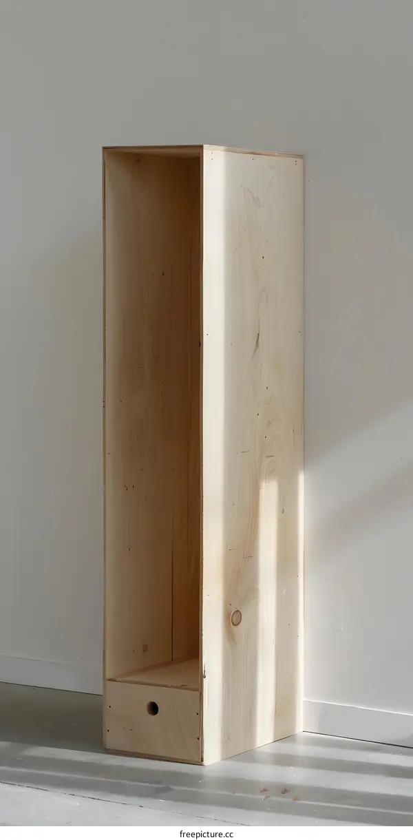 Wooden Cabinet With Drawer In A White Room