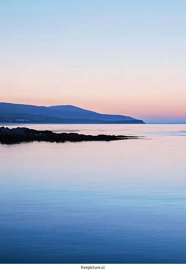 Peaceful Sea Under Pastel Sky at Sunset
