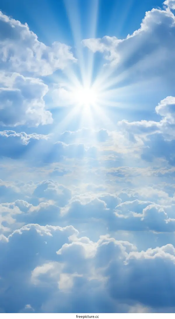 Blue sky and white clouds with sun rays shining through