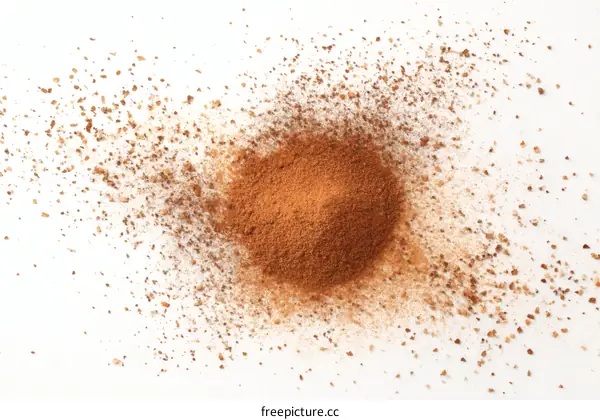 Cinnamon Powder Sprayed on White Background