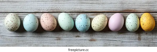 Colorful Easter Eggs on Wooden Background
