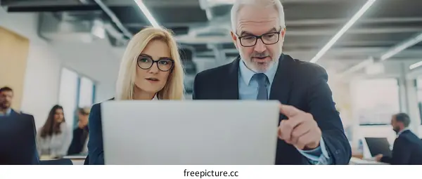 Business Professionals Working On A Project Together In A Modern Office