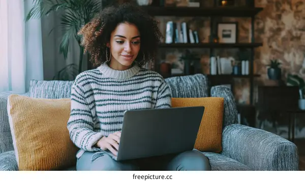 Woman Working on Laptop at Home