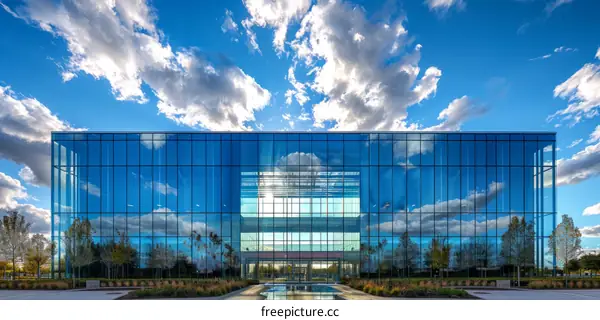 Modern Office Building with Reflective Glass Facade and Blue Sky
