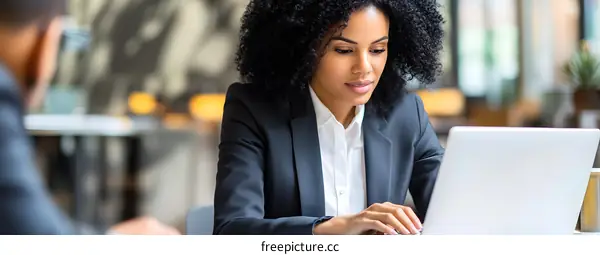 Businesswoman Working on Laptop in Office
