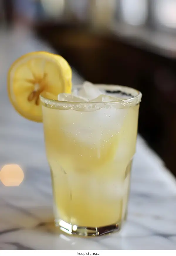 Refreshing Lemon Drink with Ice in Glass