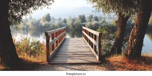 Wooden Footbridge Over a Calm River