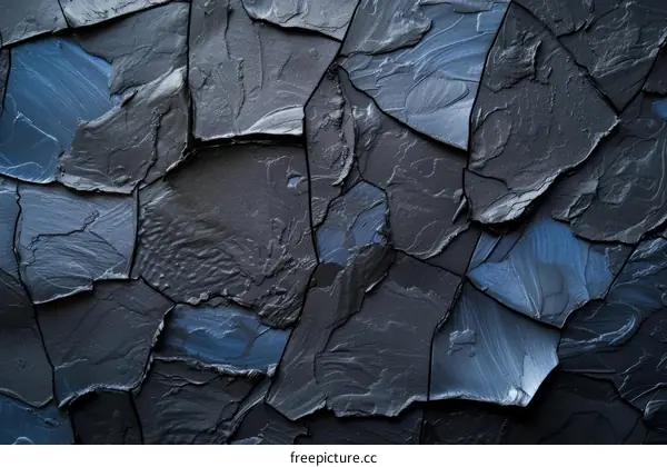 Black and blue abstract background with cracks and paint splatters