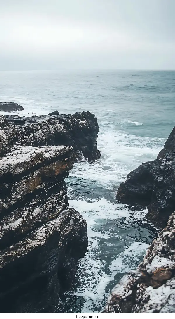 Rocky Cliffs and Foamy Ocean Waves