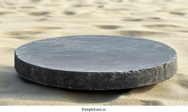 Dark Gray Stone Platform on Sandy Beach
