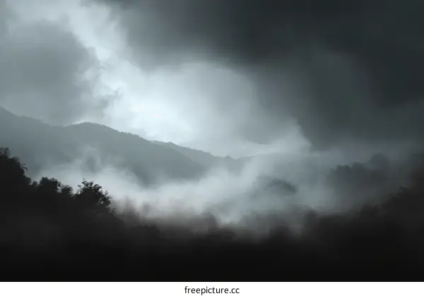 Misty Mountain Landscape Under a Cloudy Sky