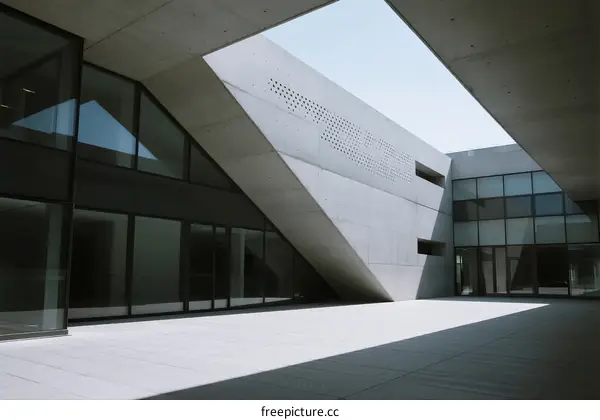 Concrete Architectural Structure with Geometric Design and Glass Facades
