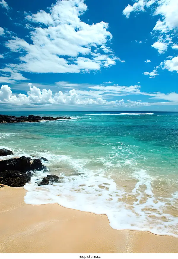 Blue Sky with White Clouds over Beach with Turquoise Water