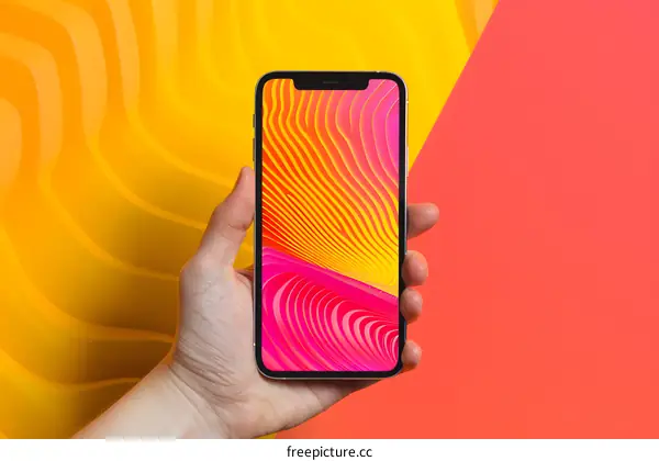 Hand Holding Smartphone With Abstract Background