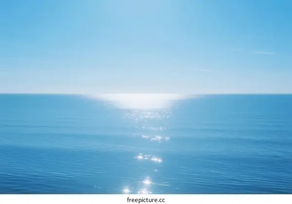 Sunlight Reflecting on Calm Blue Ocean Water Surface