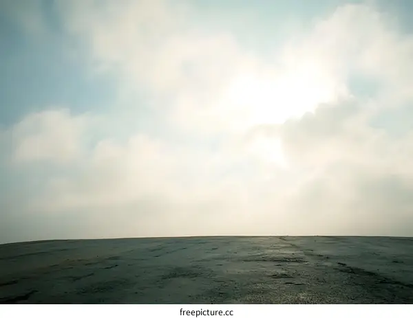 Cloudy Sky Over Grey Pavement