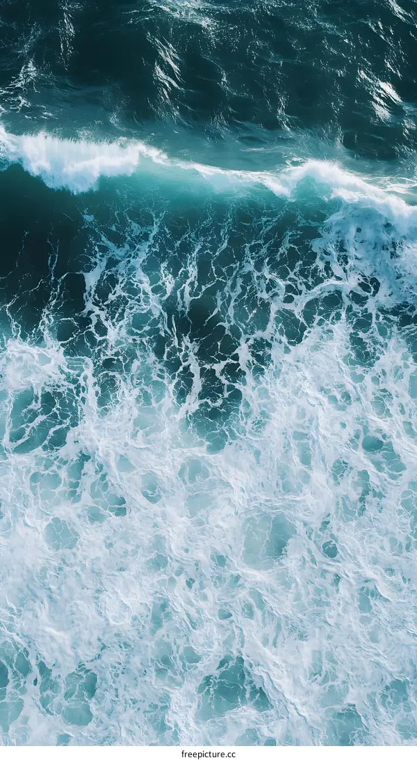 Aerial View of Ocean Waves Crashing