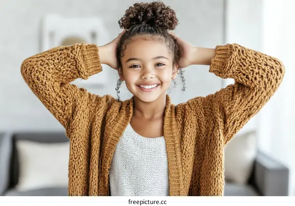 Smiling Girl in a Knitted Cardigan