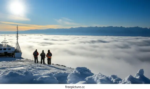 Majestic Mountaintop View Above the Clouds with Hikers