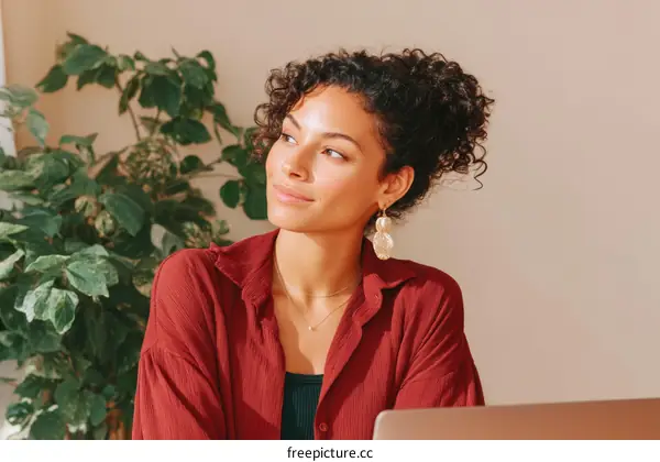 Thoughtful Woman in a Stylish Red Top