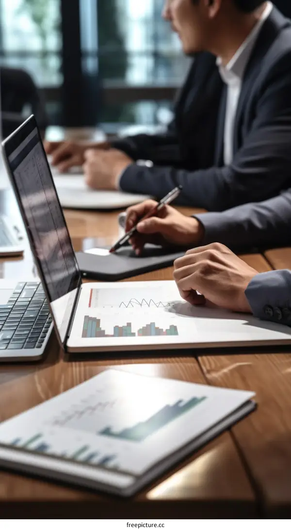 Business meeting discussing data analysis and financial report