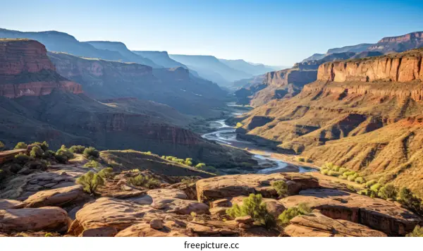 Arid desert canyon landscape with a winding river below