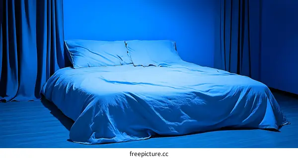 Blue Bedroom Interior With Bed And Curtains