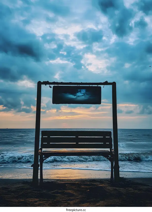 Silhouette of Bench on the Beach at Sunset