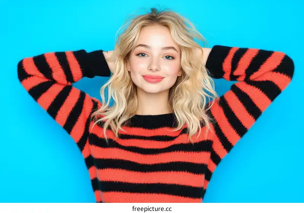 Stylish Woman in a Striped Knitted Sweater