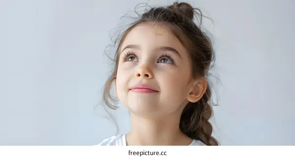 Portrait of a little girl looking up