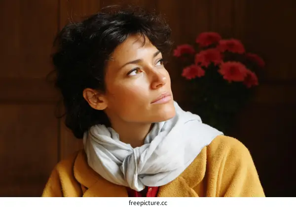 Thoughtful Woman in a Mustard Yellow Coat