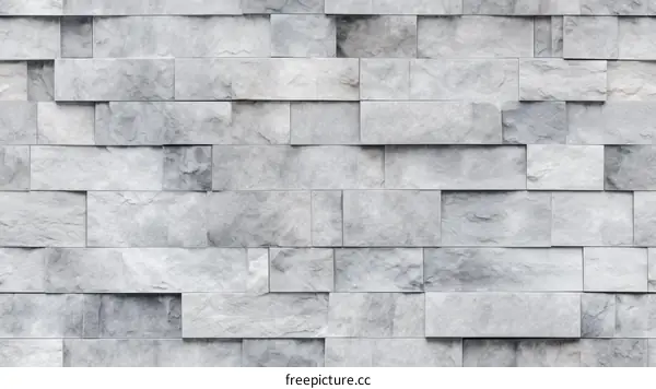 Gray and white marble tiles arranged in a brick pattern